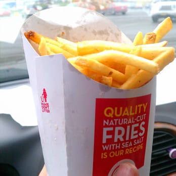 Wendy's - a hand holding a box of fries - Burgers Near Me - Oneonta, New York