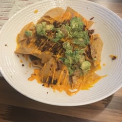 Wong Gonzalez - Chashu Pork Nachos $8: chorizo, black bean purée, quest fresco, diced tomato, avocado, sriracha aioli