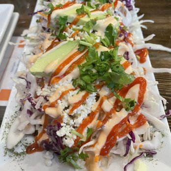 Arepitas - Tostones- there are three plantain chips below the cheese, cabbage, and avocado. - Venezuelan Near Me - Round Rock, Texas Arepitas - Tostones- there are three plantain chips below the cheese, cabbage, and avocado. - Venezuelan Near Me - Round Rock, Texas