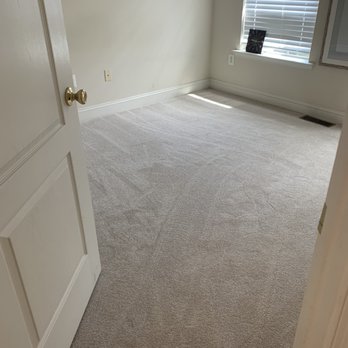 The Carpet Center - an empty room with a door open - Carpet Installation Near Me - Laurel, Maryland