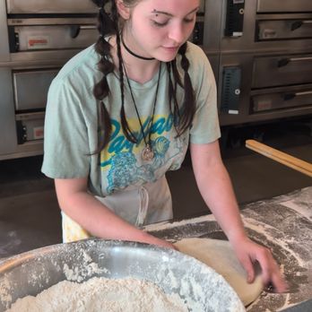 Pagliacci Pizza - Preparing the pizza - Pizza Near Me - Kirkland, Washington Pagliacci Pizza - Preparing the pizza - Pizza Near Me - Kirkland, Washington