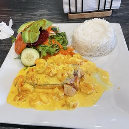 Salmon with shrimp rice and fresh salad. Salmon with shrimp rice and fresh salad.