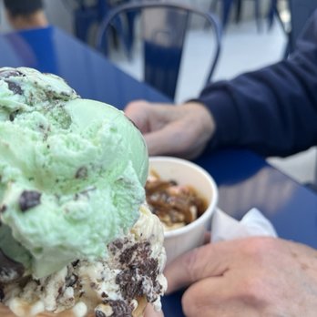 Huddy's - Double ice-cream cone (Deer Trax / Mint Deer Trax) and a Turtle Sundae - Ice Cream & Frozen Yogurt Near Me - Hudsonville, Michigan