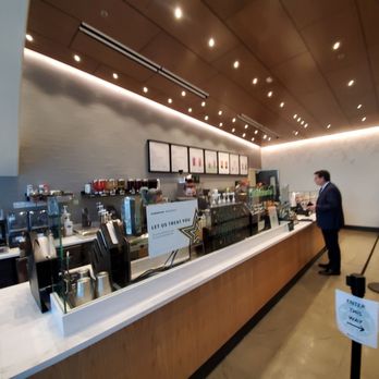 Starbucks - a man standing at the counter of a starbucks coffee shop - Coffee & Tea Near Me - Sacramento, California Starbucks - a man standing at the counter of a starbucks coffee shop - Coffee & Tea Near Me - Sacramento, California