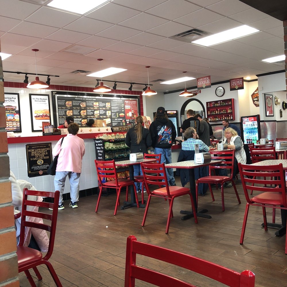 Firehouse Subs - a restaurant with red chairs and tables - Fast Food Near Me - Findlay, Ohio Firehouse Subs - a restaurant with red chairs and tables - Fast Food Near Me - Findlay, Ohio