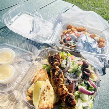 Beachside Gyros - Lamb Gyro with Feta Tots, Greek Salad with house dressing and one Chicken Skewer served with pita. - Greek Near Me - Flagler Beach, Florida Beachside Gyros - Lamb Gyro with Feta Tots, Greek Salad with house dressing and one Chicken Skewer served with pita. - Greek Near Me - Flagler Beach, Florida