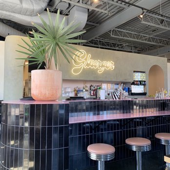 G Burger - a view of a bar with stools and a potted plant - Burgers Near Me - Ottawa, Ontario G Burger - a view of a bar with stools and a potted plant - Burgers Near Me - Ottawa, Ontario
