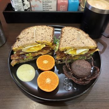 UT47 Kitchen & Bar - My food was so delicious! A breakfast sandwich with oranges and a fudge brownie. The sauce for the sandwich was so tasty! - Breakfast & Brunch Near Me - New York, New York