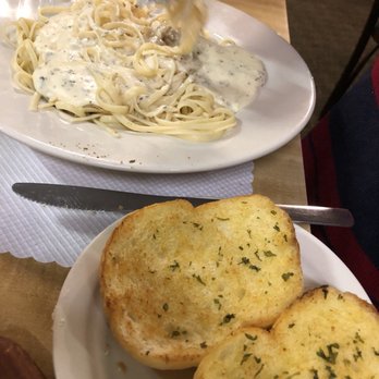 Pink Poodle Steakhouse - Fettuccine Alfredo with garlic bread - Steakhouses Near Me - Crescent, Iowa Pink Poodle Steakhouse - Fettuccine Alfredo with garlic bread - Steakhouses Near Me - Crescent, Iowa