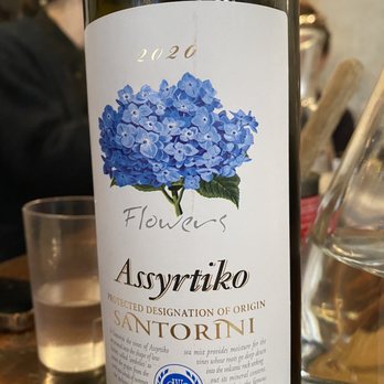 Kiki's - a bottle of wine on a table - Greek Near Me - New York, New York Kiki's - a bottle of wine on a table - Greek Near Me - New York, New York