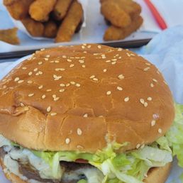 Guacamole Burger (2 beef patties) with Swiss cheese and guacamole and fried zucchini sticks. Sooo good!!! Guacamole Burger (2 beef patties) with Swiss cheese and guacamole and fried zucchini sticks. Sooo good!!!