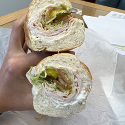 Flip Flop Sub Shop - Turkey and provolone sub with lettuce, tomato, jalapeños, banana peppers, pickles, Mayo, salt, pepper, and oregano on white bread