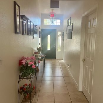 Tatum Glen Assisted Living - Hallway leading to locked front door with safety camera and ring doorbell - Assisted Living Facilities Near Me - Phoenix, Arizona