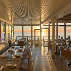 Driftwood Kitchen - Main dining looking out to balcony seating. Ocean view