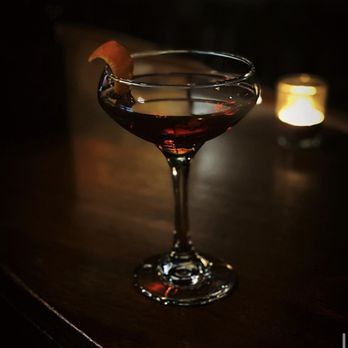 Muse Spirits - a glass of wine on a table - Cocktail Bars Near Me - Chicago, Illinois Muse Spirits - a glass of wine on a table - Cocktail Bars Near Me - Chicago, Illinois
