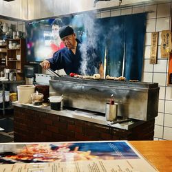 Sitting at the bar - watching the chef literally of my dreams conduct a symphony on that grill! Gingko Nuts please !