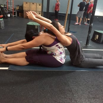 Tribe Athletics - Fit mamas getting their stretch on - Interval Training Gyms Near Me - Los Alamitos, California