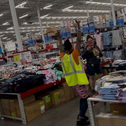 BJ's Wholesale Club - Employees trying on the clothes they are supposed to be folding...