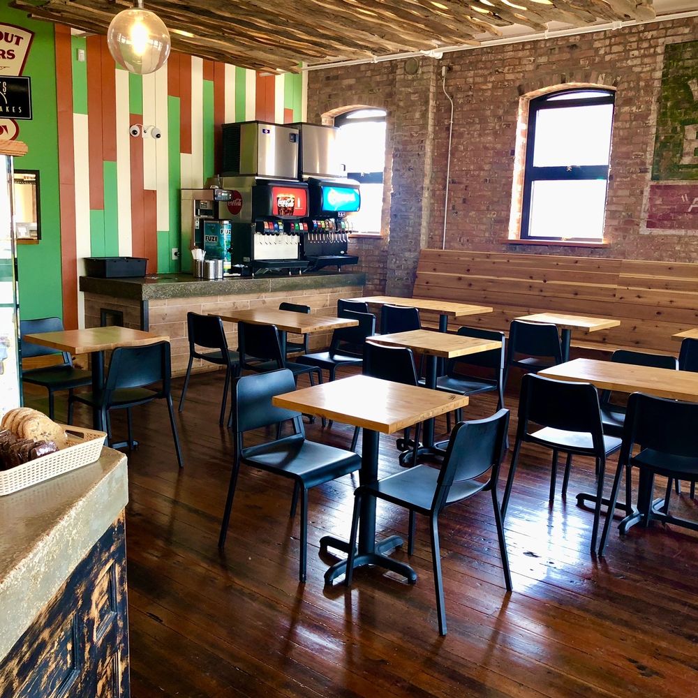 Amighettis - a restaurant with tables and chairs - Italian Near Me - Saint Louis, Missouri
