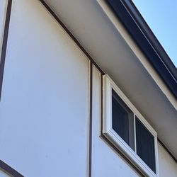 Ralph Force Enterprises  Siding, Windows, Patios and Carports - Windows installed halfway outside house.