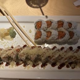The roll with orange in the middle is the spicy salmon roll and the other one is the crunchy roll The roll with orange in the middle is the spicy salmon roll and the other one is the crunchy roll