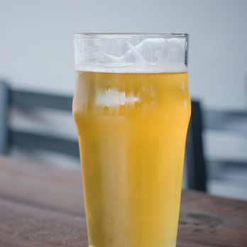 Menace Brewing - a glass of beer on a table - Beer Bar Near Me - Bellingham, Washington Menace Brewing - a glass of beer on a table - Beer Bar Near Me - Bellingham, Washington