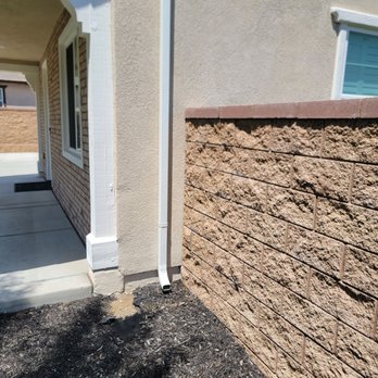 JG Seamless Gutters - Right side of house showing downspout - Gutter Services Near Me JG Seamless Gutters - Right side of house showing downspout - Gutter Services Near Me