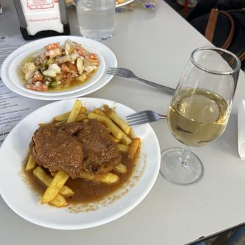 Casa Balbino - Salpicón in the background and solomillo de cerveza and a copa of manzanilla - Tapas/Small Plates Near Me - Sanlucar de Barrameda, California