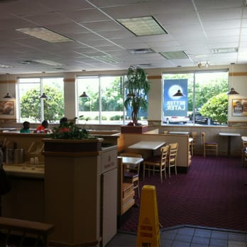 Wendy's - a woman sitting at a table in a restaurant - Fast Food Near Me - Jacksonville, Florida Wendy's - a woman sitting at a table in a restaurant - Fast Food Near Me - Jacksonville, Florida