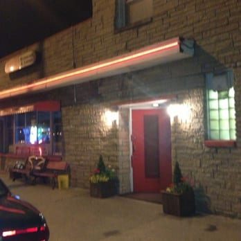Gard's - Gards is a triangular lot with a tent covered outside patio with seating. - American Near Me - Milwaukee, Wisconsin