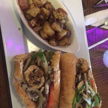 Mellow Mushroom Paducah - Steak and Pepper sandwich on French bread with Seasoned potatoes - Pizza Near Me - Paducah, Kentucky Mellow Mushroom Paducah - Steak and Pepper sandwich on French bread with Seasoned potatoes - Pizza Near Me - Paducah, Kentucky