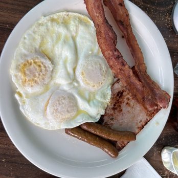 Rae's Restaurant - "The Hobo" 3 eggs, over medium, ham, sausage , and bacon....along with 3 pancakes!!! - Diners Near Me - Santa Monica, California