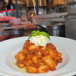 Pesto Italian Craft Kitchen - Gnocchi bolognese with ricotta and fresh basil. Olive oil