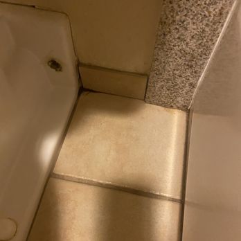Best Western Pier Point Inn - Separating tiles that flop on the wall with black mold around them - Hotels Near Me - Florence, Oregon Best Western Pier Point Inn - Separating tiles that flop on the wall with black mold around them - Hotels Near Me - Florence, Oregon
