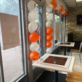 Chicken House and Catering - a long table with balloons attached to it - Fast Food Near Me - Edmonton, Alberta Chicken House and Catering - a long table with balloons attached to it - Fast Food Near Me - Edmonton, Alberta