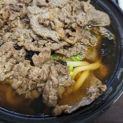 Fried Wings House - Udon Noodle Soup  Thick wheat noodles served in a savory broth with mushrooms. Topped with nori and scallions - added the Bulgogi