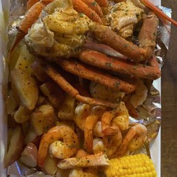 crab legs, potatoes, corn, and corn on the cob crab legs, potatoes, corn, and corn on the cob