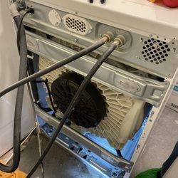 Green Machine Appliance Repair - Accessing a drain pump from the rear of a Whirlpool Washer