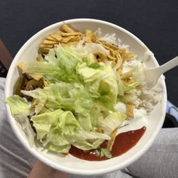 a person holding a bowl of food a person holding a bowl of food