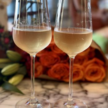 CasaDamí - Champagne in wine glasses - Modern European Near Me - Newport Beach, California CasaDamí - Champagne in wine glasses - Modern European Near Me - Newport Beach, California