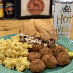 Kirby Cosmo's BBQ Bar - Carolina pulled pork with a side of Mac and cheese and jalapeño hushpuppies