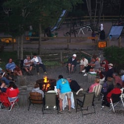 Sault Ste. Marie KOA - A group enjoying a get-together by the community fire pit.