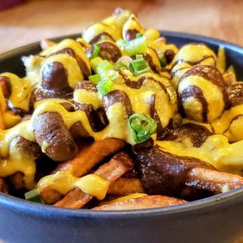 Lola Rosa - Petite Poutine Lola- sweet + Yukon potato fries, mushroom + black bean gravy, tumeric, cheese curds. Delicious! - Vegan Near Me - Montreal, Quebec Lola Rosa - Petite Poutine Lola- sweet + Yukon potato fries, mushroom + black bean gravy, tumeric, cheese curds. Delicious! - Vegan Near Me - Montreal, Quebec