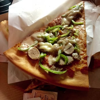 Talarico's Pizzeria - Slices to go! These things are huge; the photo doesn't do them justice! - Pizza Near Me - Seattle, Washington Talarico's Pizzeria - Slices to go! These things are huge; the photo doesn't do them justice! - Pizza Near Me - Seattle, Washington
