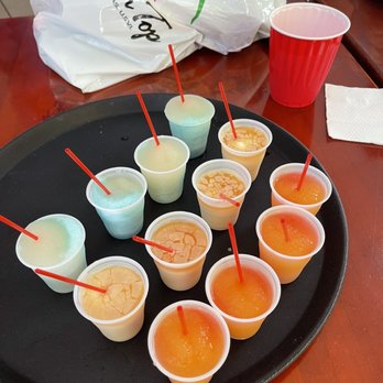 Shama's Specialties - a tray of small cups of liquid - Bakeries Near Me - Charlotte Amalie, Virgin Islands