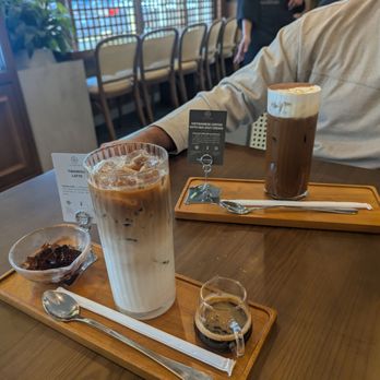 Trung Nguyen Legend - Tiramisu latte in the front and Vietnamese iced coffee with sea salt cream in the back - Coffee & Tea Near Me - Portland, Oregon Trung Nguyen Legend - Tiramisu latte in the front and Vietnamese iced coffee with sea salt cream in the back - Coffee & Tea Near Me - Portland, Oregon
