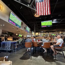 Sports bar area while sitting in huge dining room. TVs all around!! Sports bar area while sitting in huge dining room. TVs all around!!