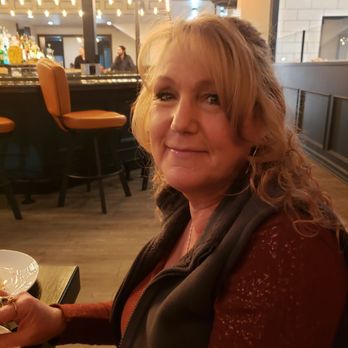Feast - My lovely wife looking totally relaxed with the bar in the background - Steakhouses Near Me - Chesterfield, Michigan Feast - My lovely wife looking totally relaxed with the bar in the background - Steakhouses Near Me - Chesterfield, Michigan