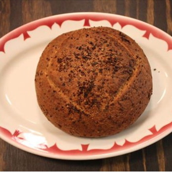 North Woods Bread - a chocolate bun on a plate - Bakeries Near Me - Schroon Lake, New York North Woods Bread - a chocolate bun on a plate - Bakeries Near Me - Schroon Lake, New York
