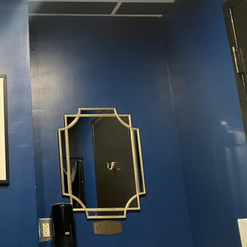 Haute Dogs  - a bathroom with blue walls - Hot Dogs Near Me - Arlington, Virginia
